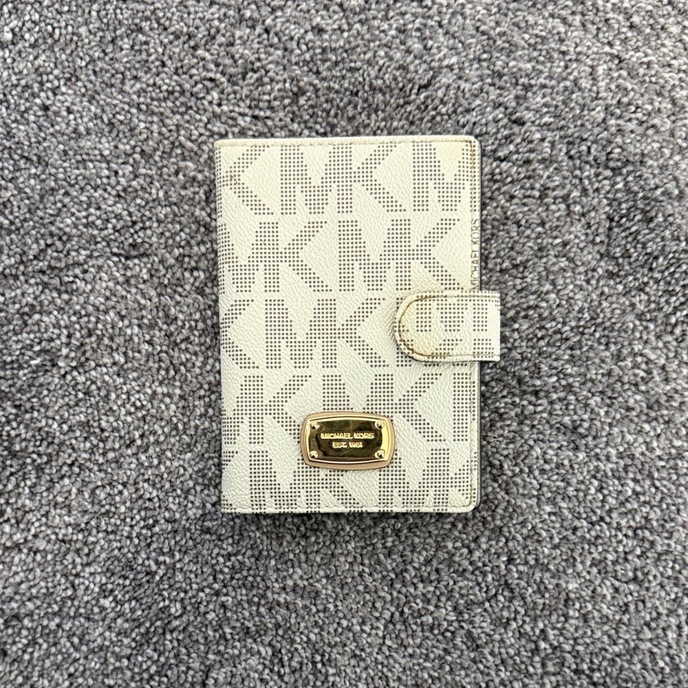 Michael Kors Cream Perforated MK Monogram Passport Cover with Gold Plaque